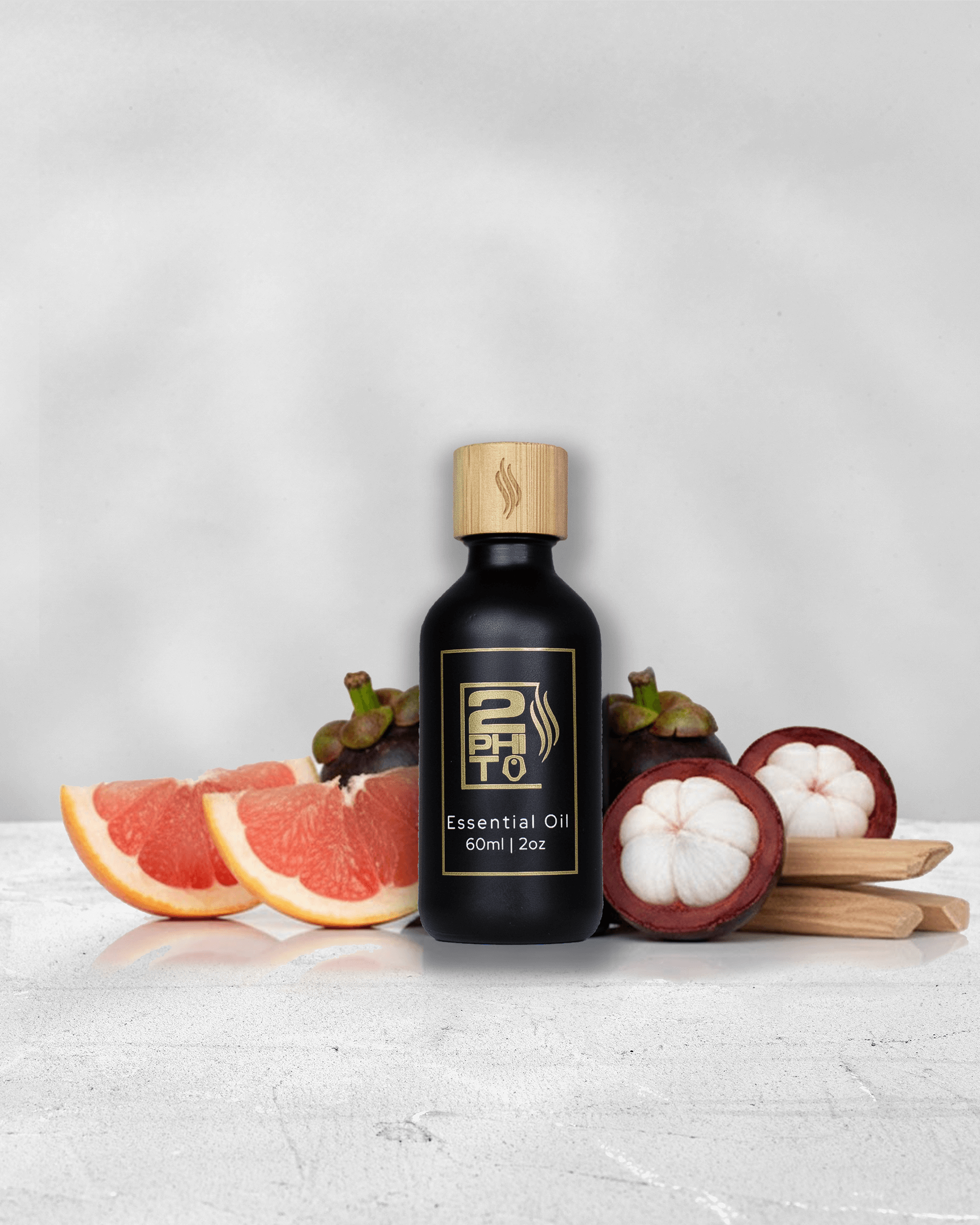 Caribbean Sunrise - Signature Fragrance with citrus fruits and essential oil bottle on a white background.